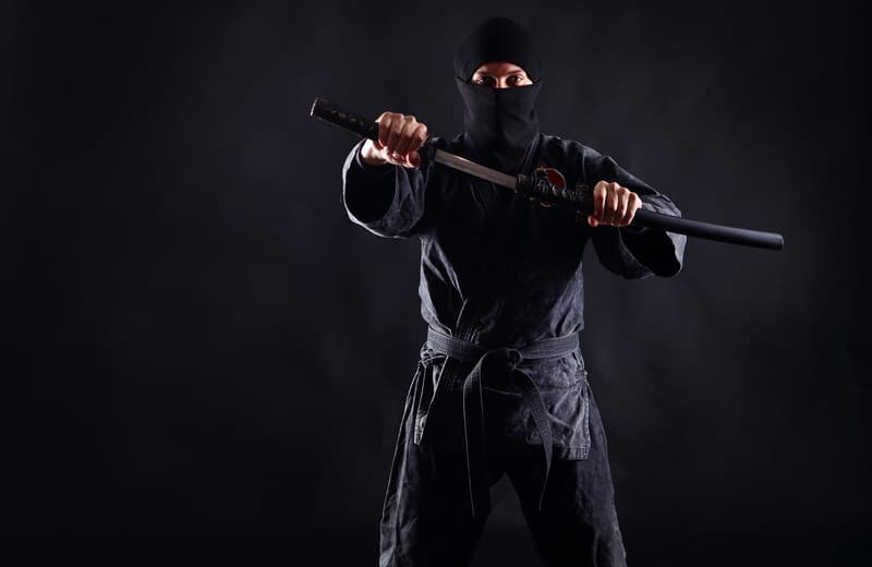Ninja with katana black background