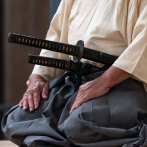 Samurai with daisho set of katana and wakizashi meditating about the Bushido code