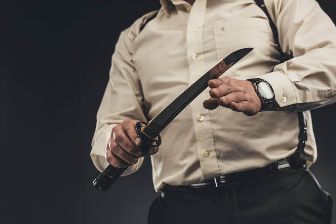 Man-Holding-Spring-Steel-Katana